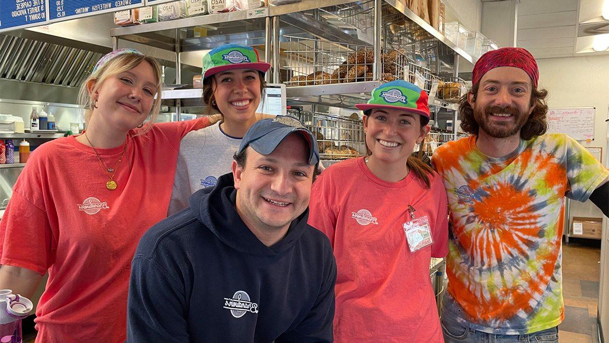 The staff of Brandwein's Bagels posing for a group photo in the shop.